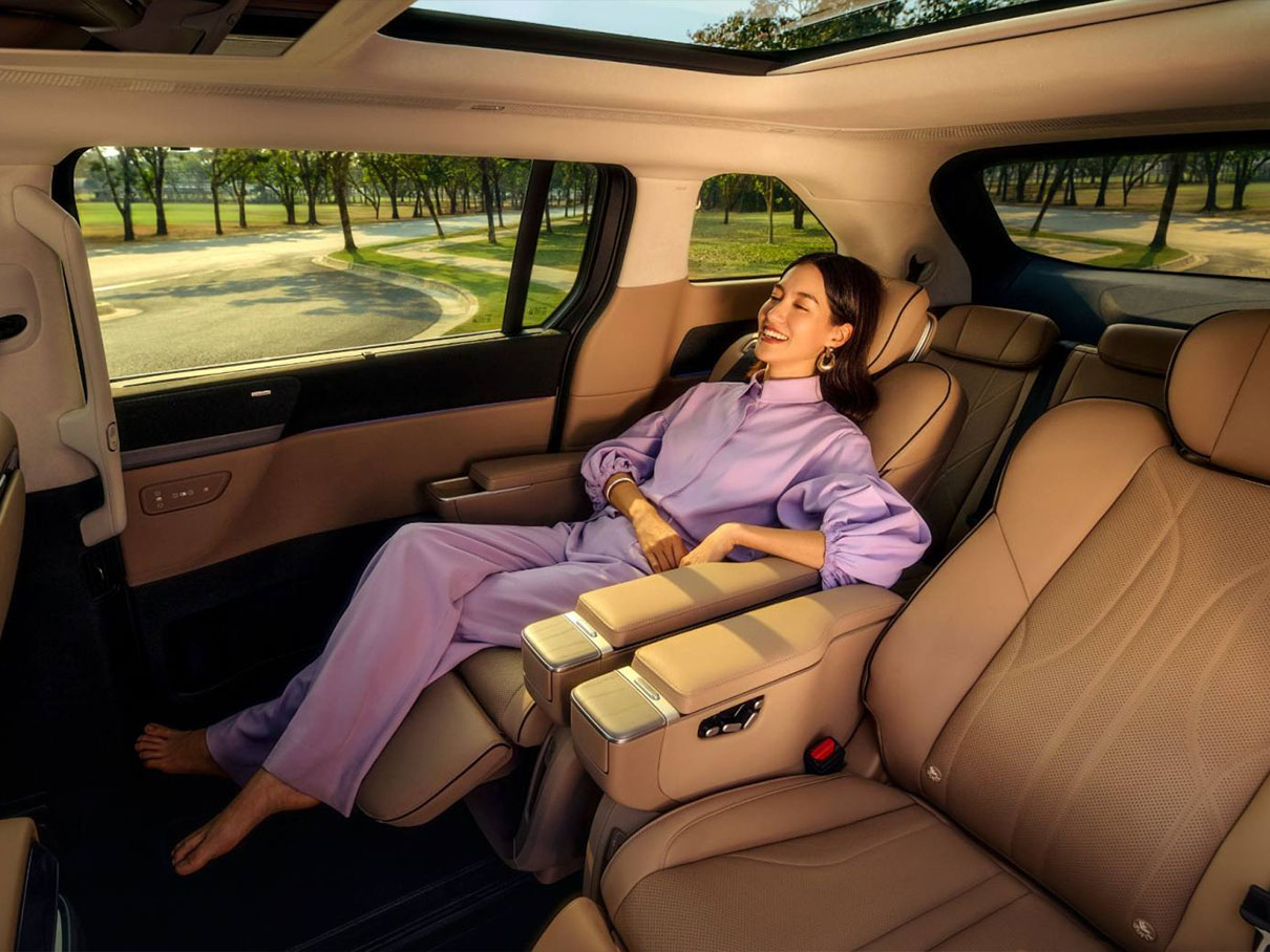 A lady reclines in the rear of an XPENG X9 MPV